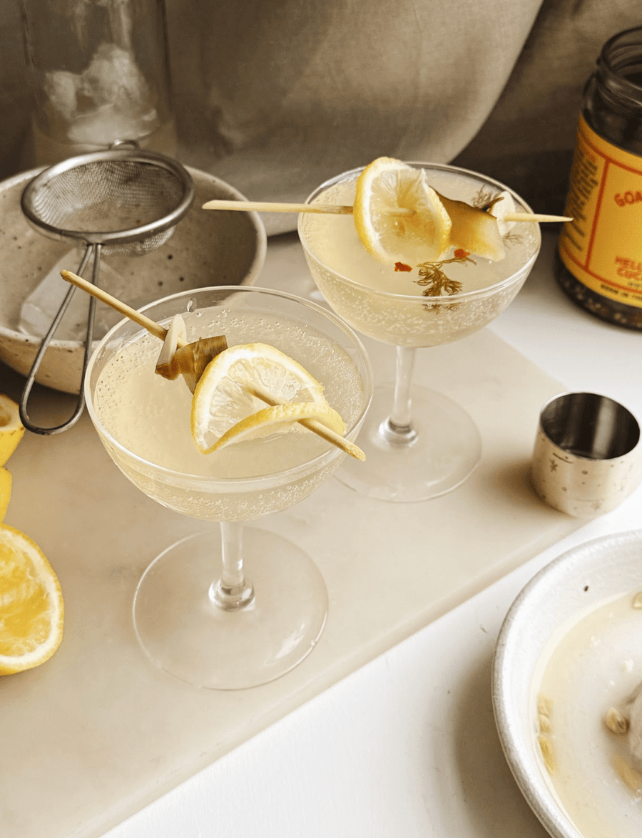 Flora Shedden Hell or Highwater Fizz pickle juice cocktail garnished with dill and lemon